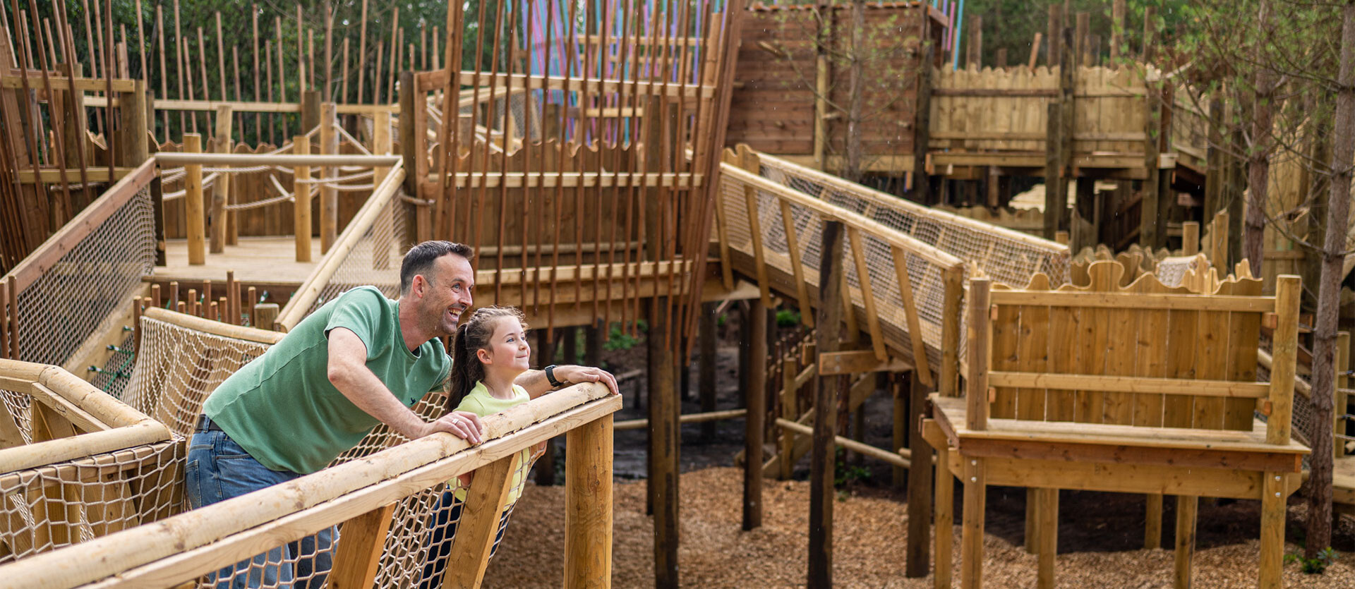 A father and daughter explore the Towering Treetop Tangles at BeWILDerwood