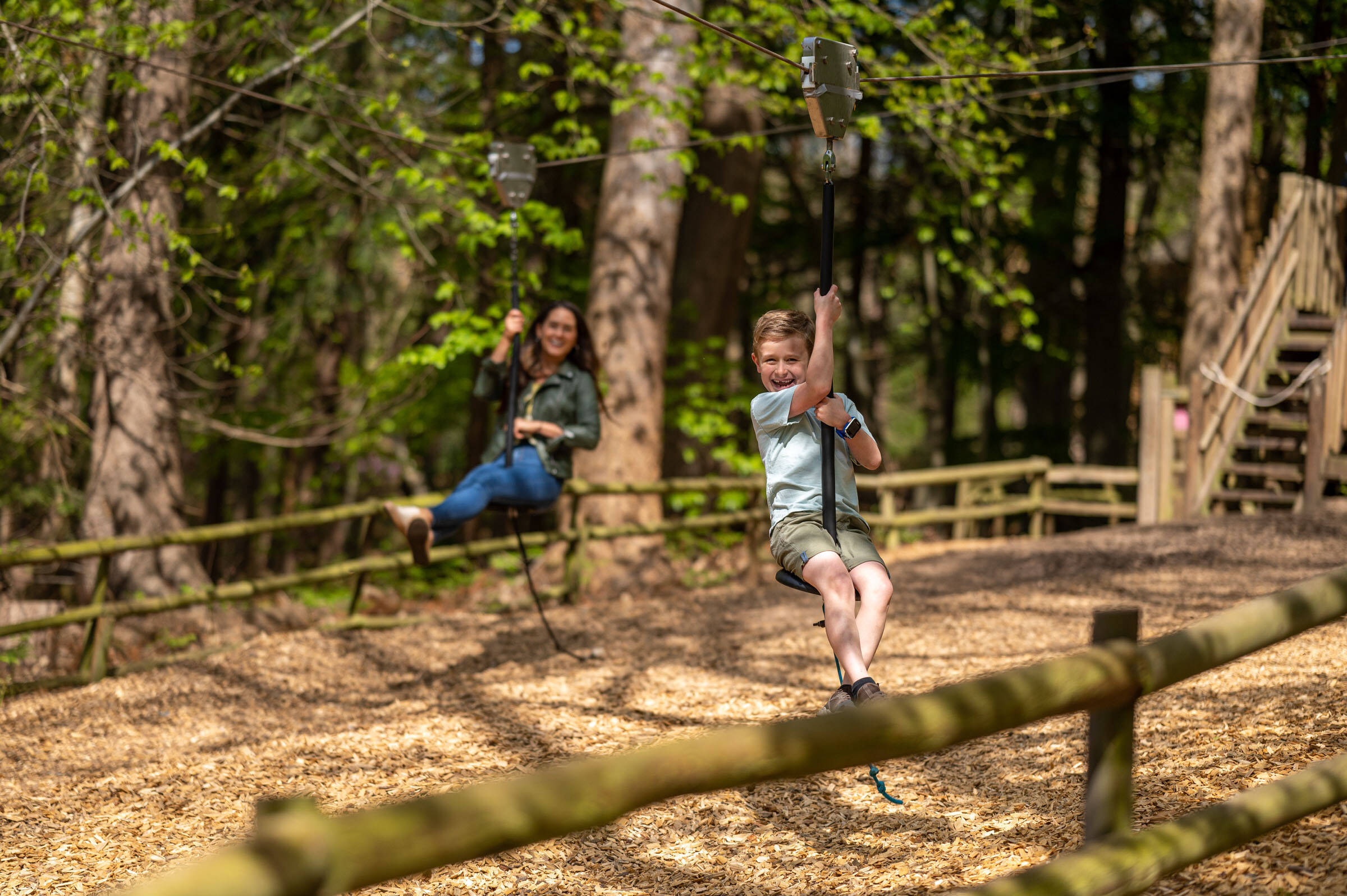 Mum and son on zip wire